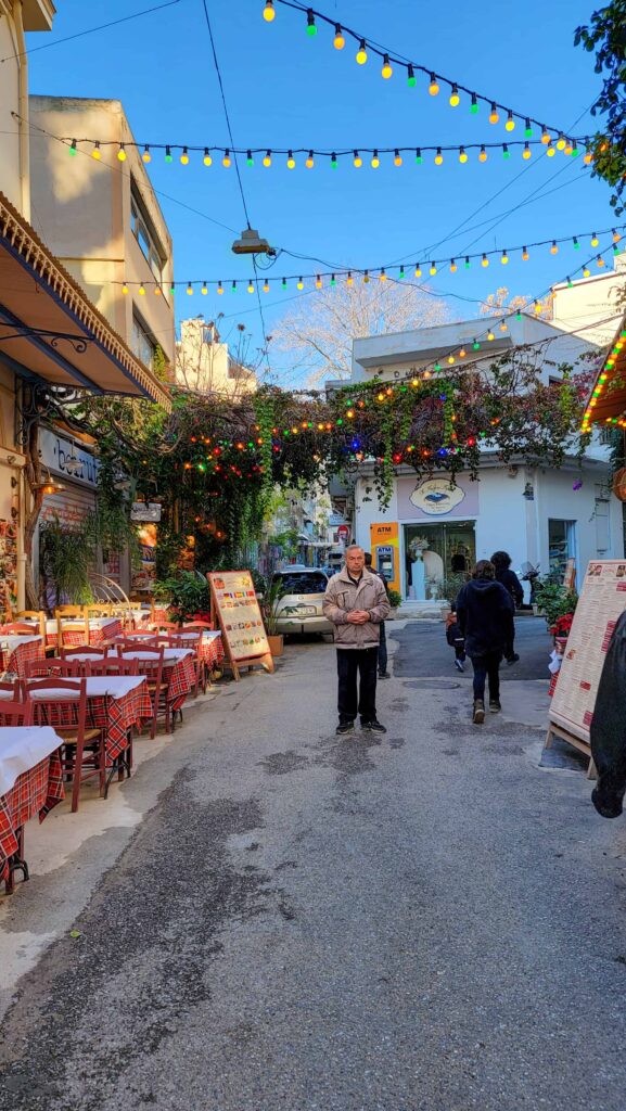 a Greek man on a small street in Athens
