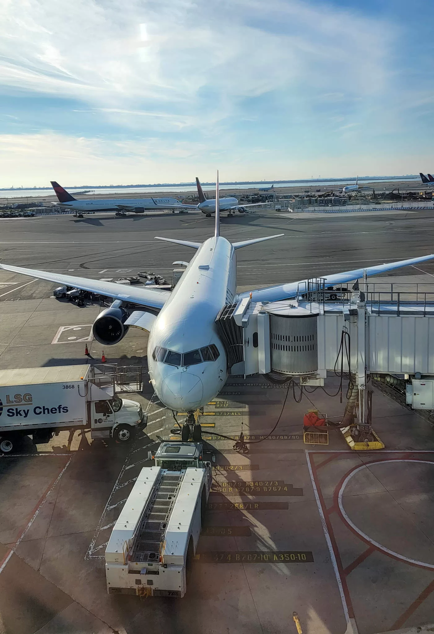 a plane parked at the gate at the airport