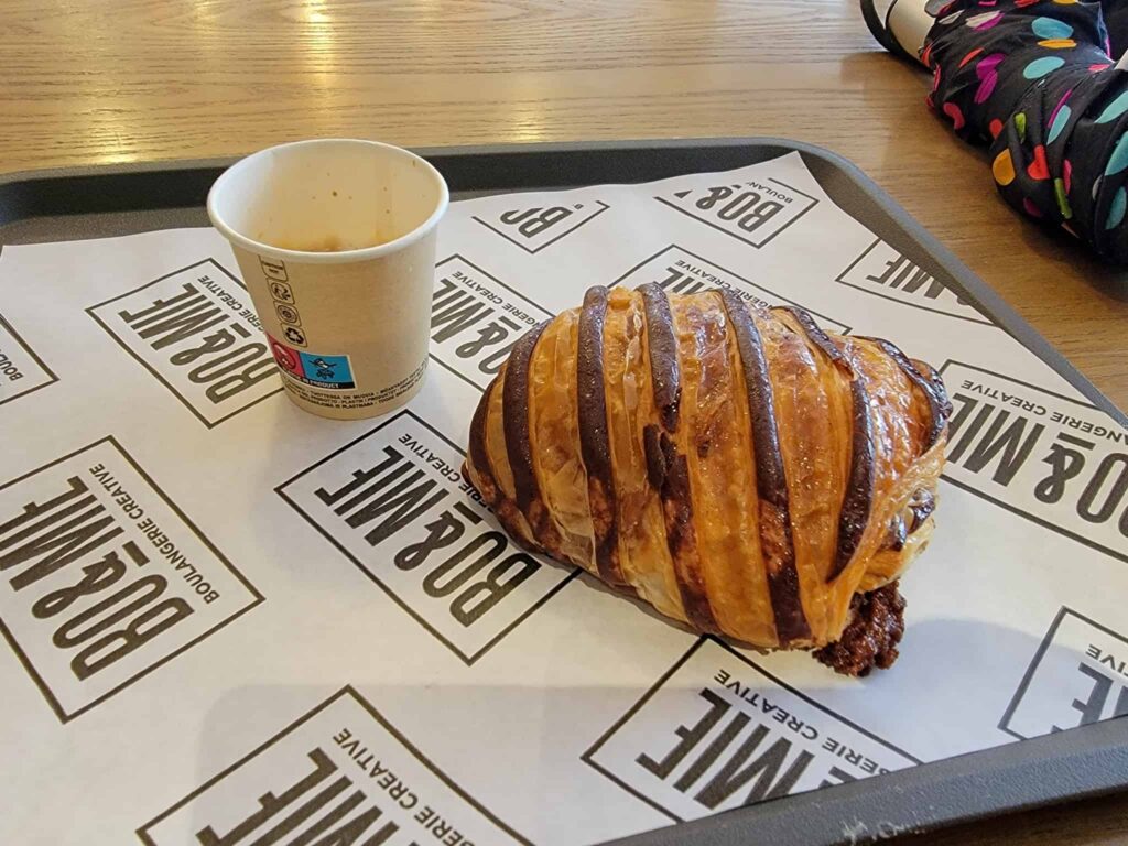 a croissant and espresso at a bakery in paris