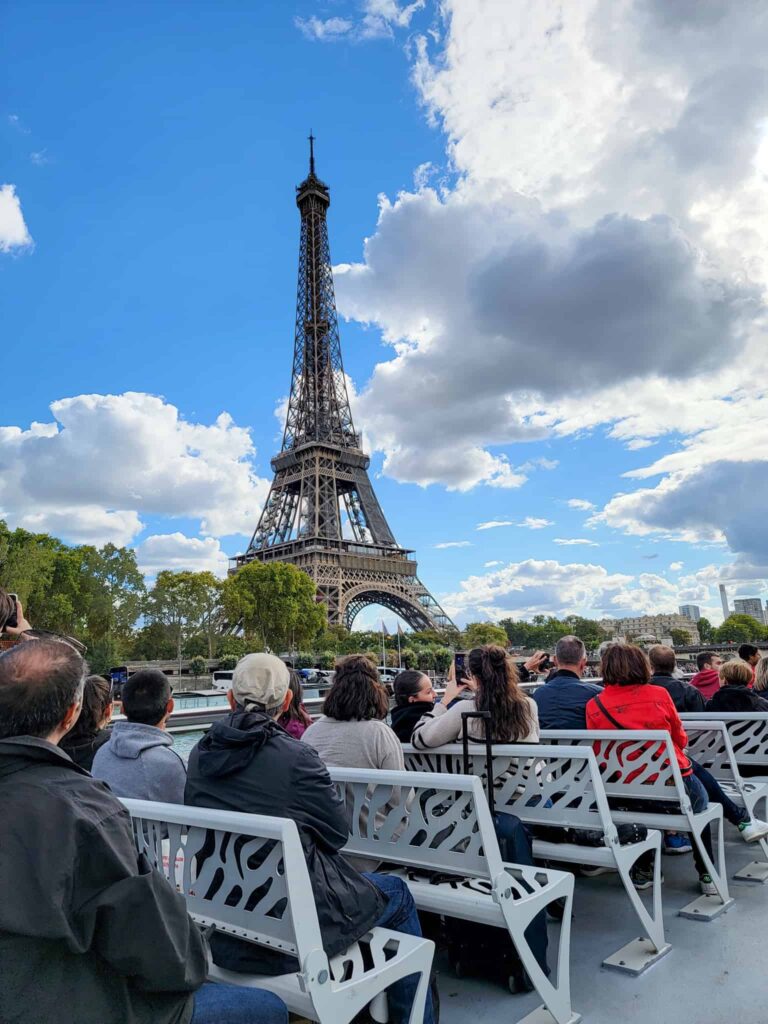 view of the eiffel tower from a bateaux mouches cruise on the seine