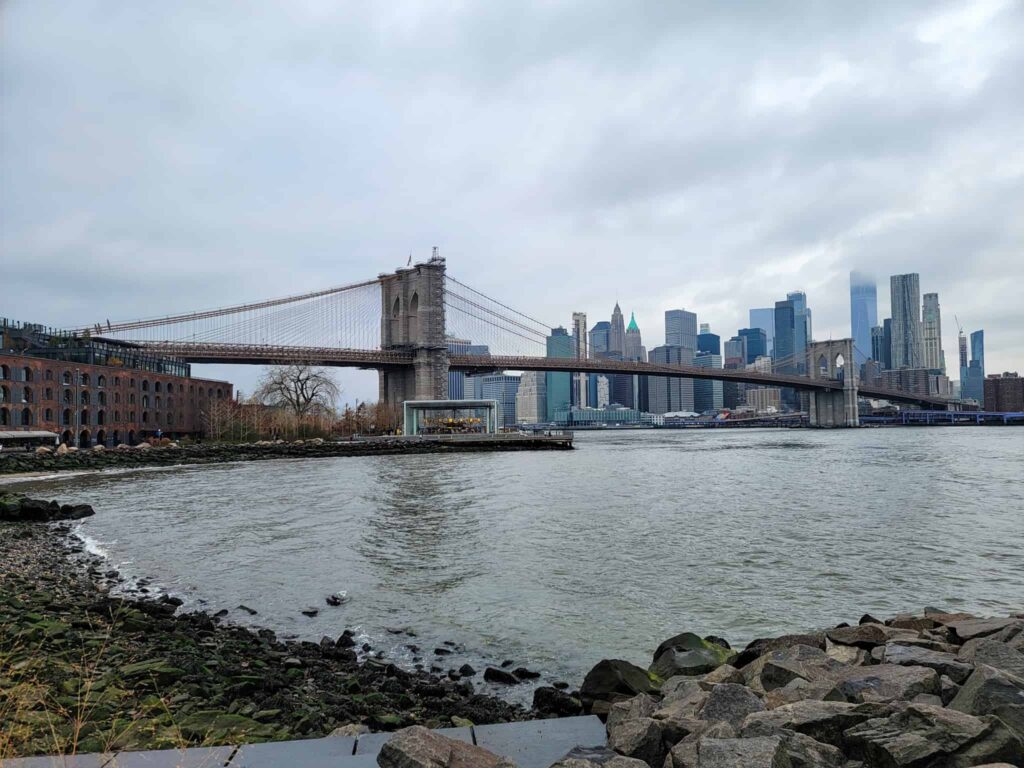 view of Brooklyn Bridge from DUMBO, a destination that's part of the beginner's guide to NYC