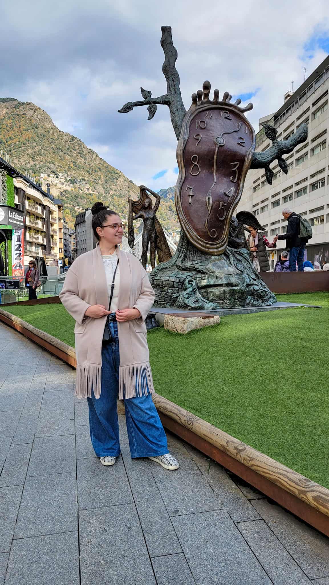 the author in front of la noblesse du temps sculpture in andorra