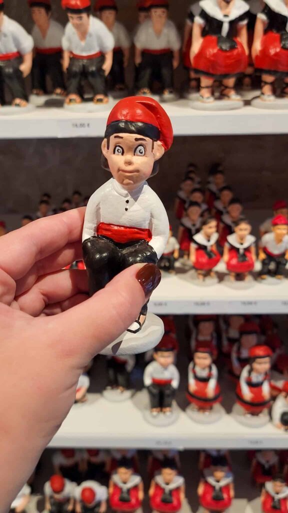 front of el caganer figurine, one of the best souvenirs from Barcelona