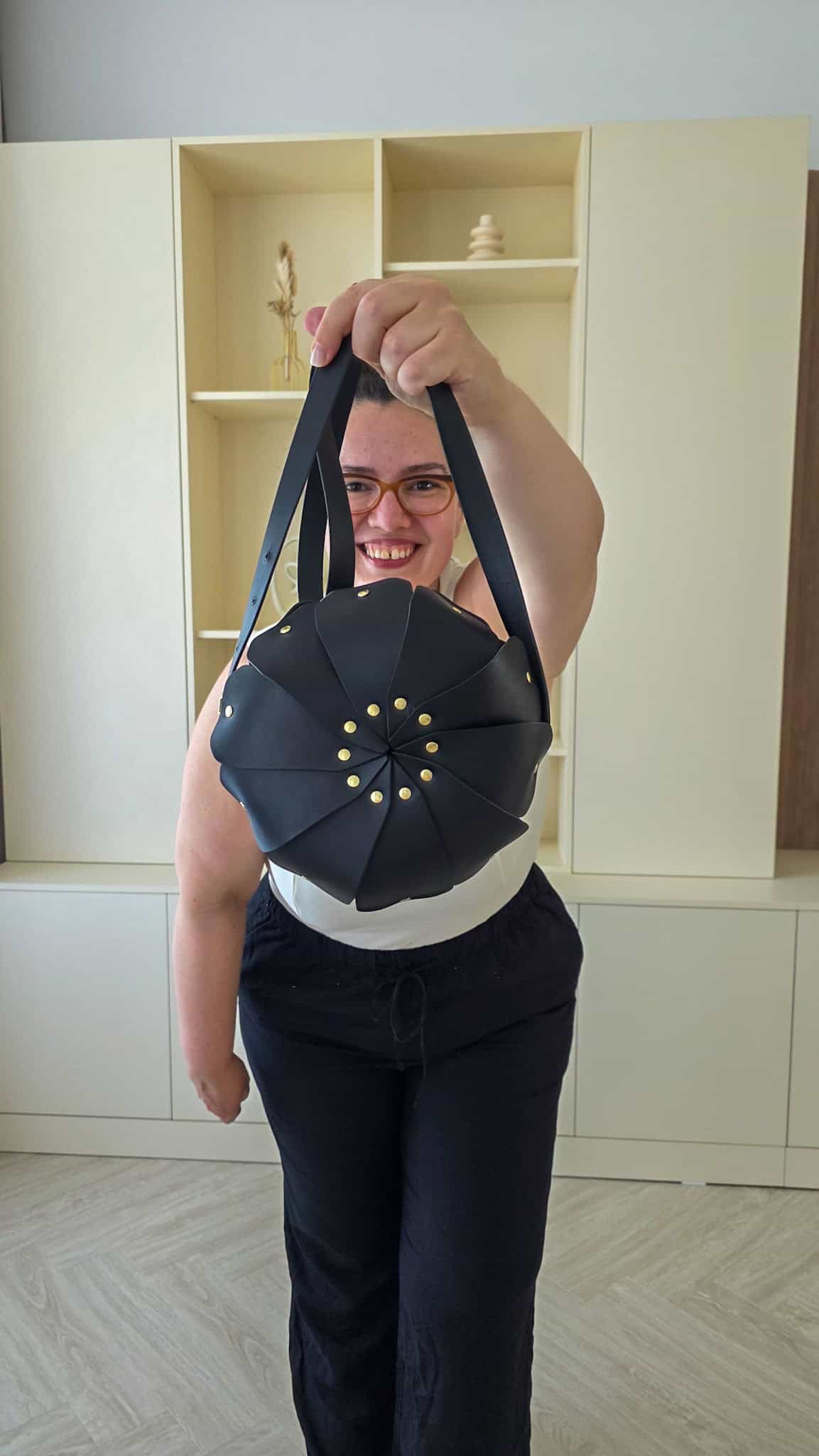 the author holding a purse from atelier madre manuel dreesmann barcelona