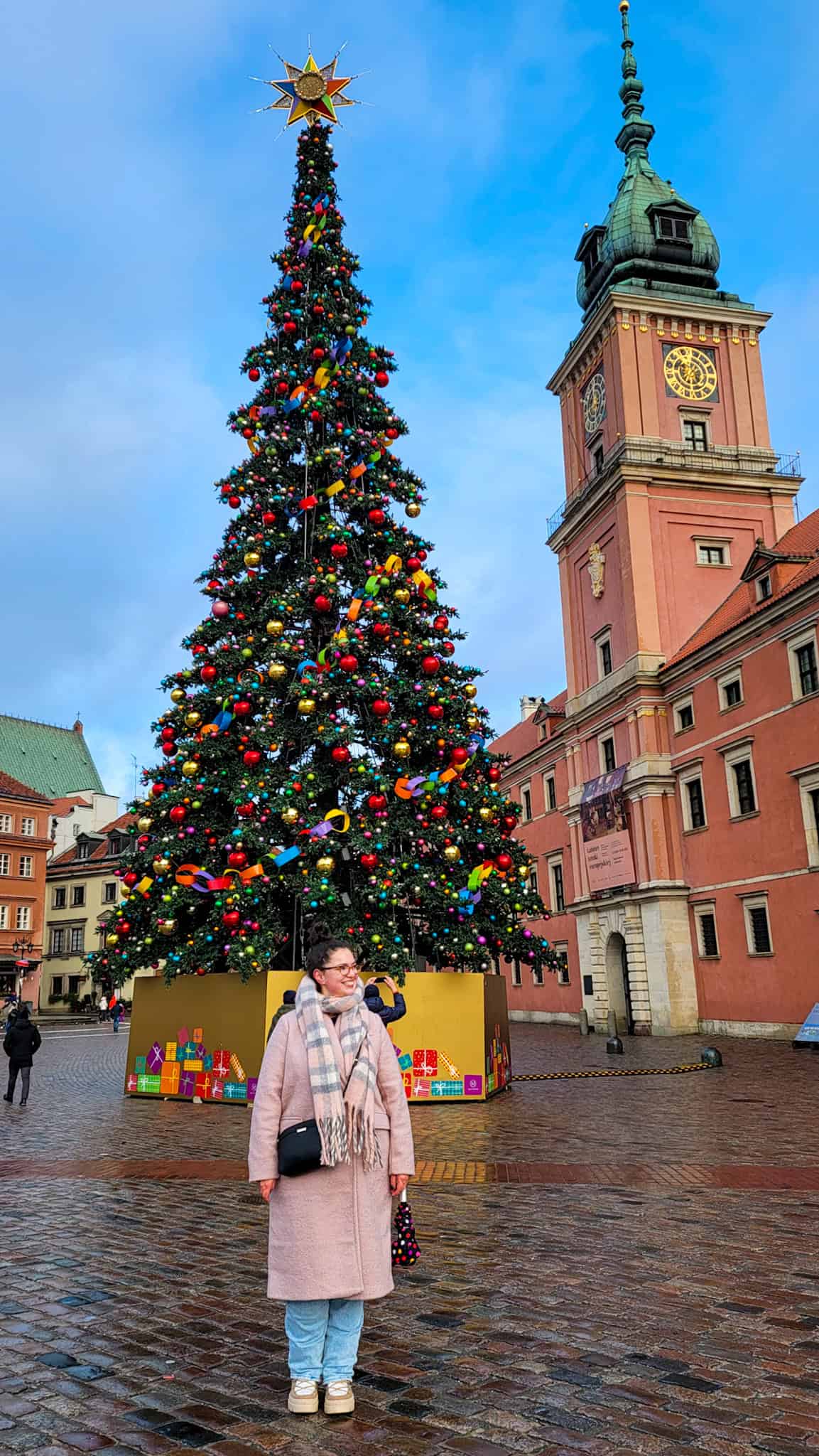 the author in front of the christmas tree at warsaw christmas market