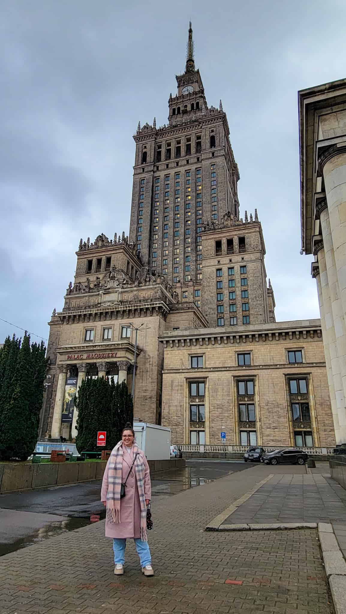 the author in front of the palace of culture and science in warsaw