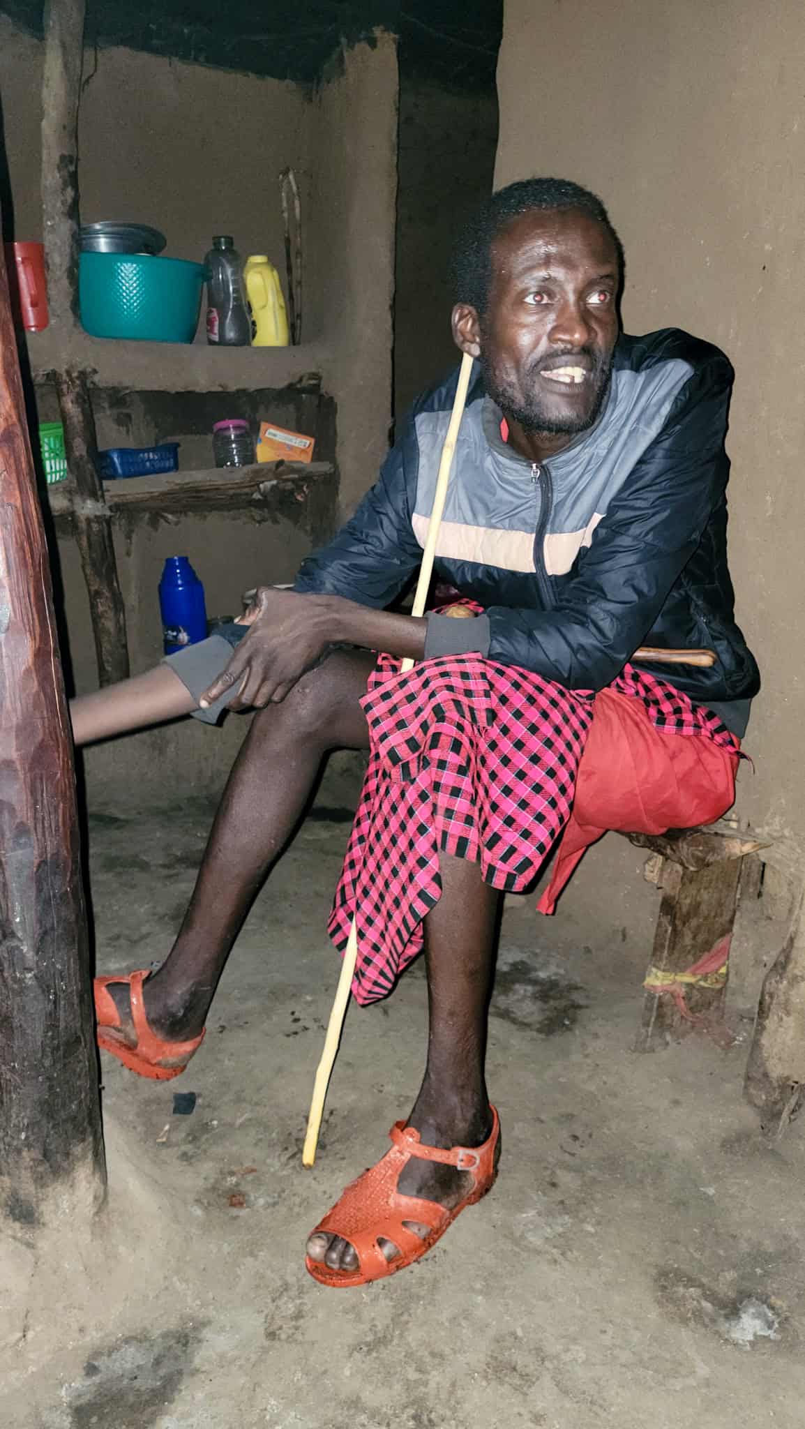 a maasai man in his hut