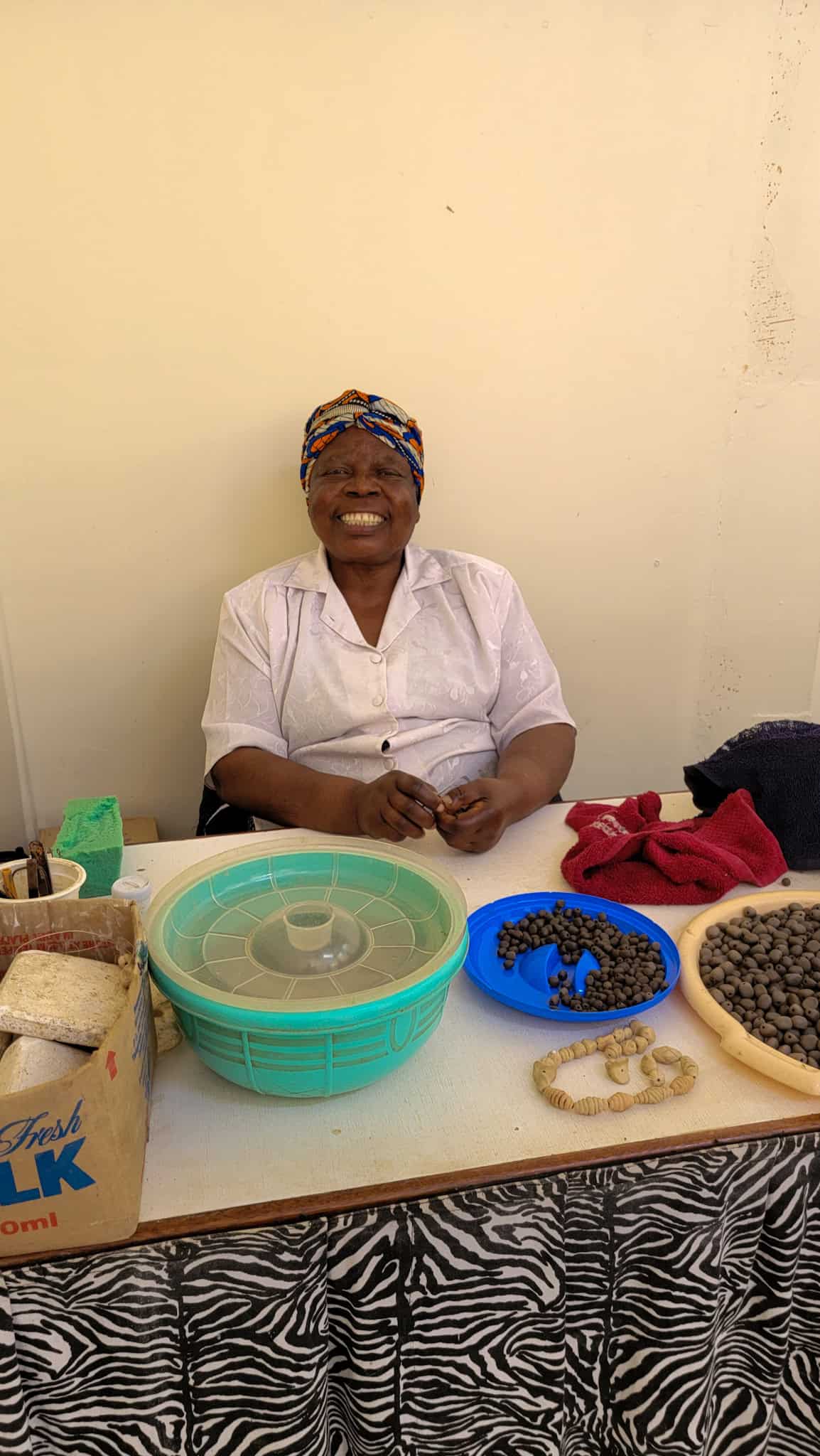 kenyan woman making beads from clay in Nairobi