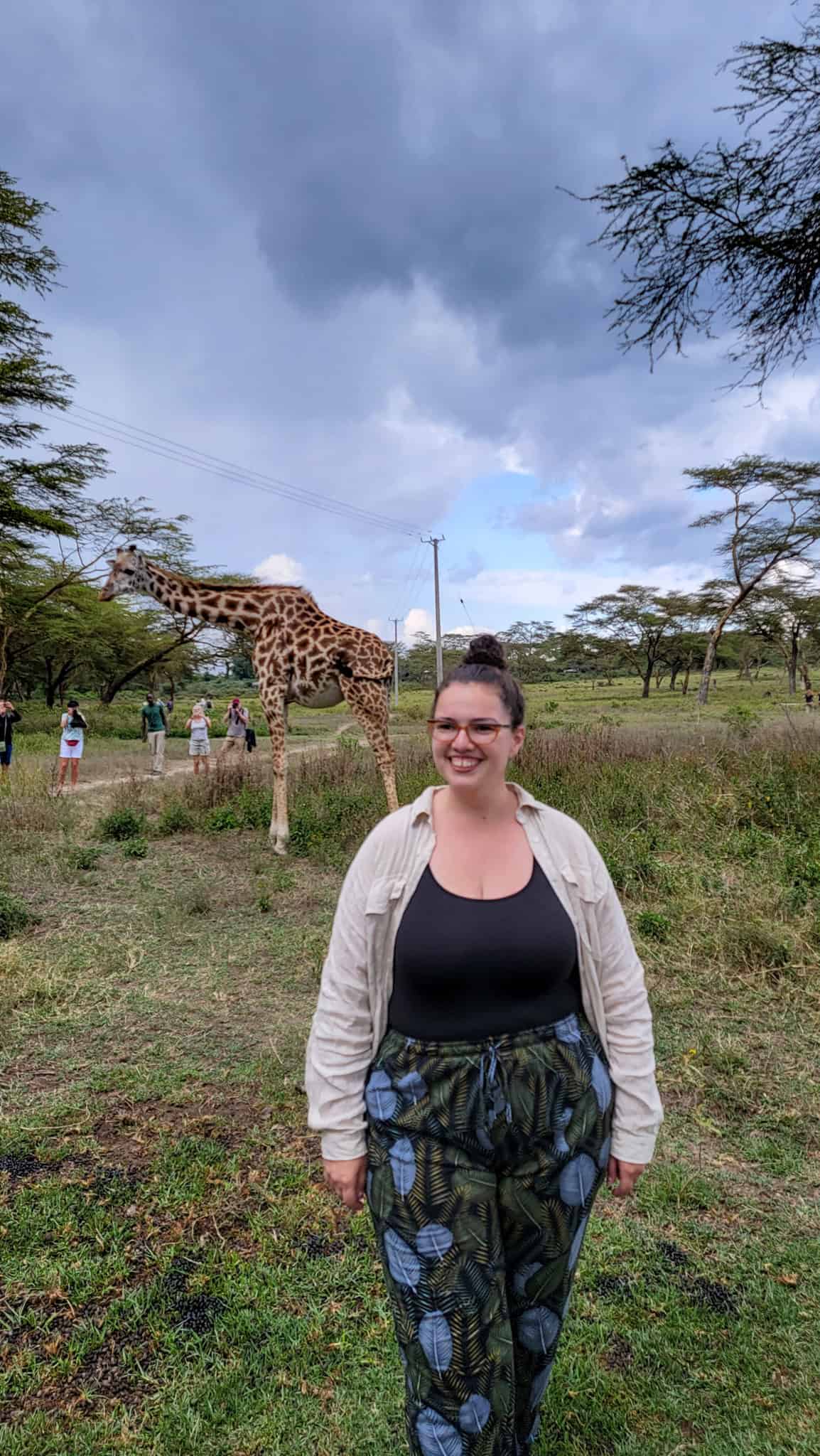 the author and a giraffe on crescent island