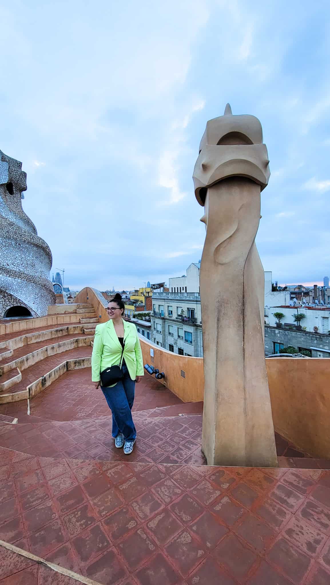 the author and a statue on the casa mila rooftop