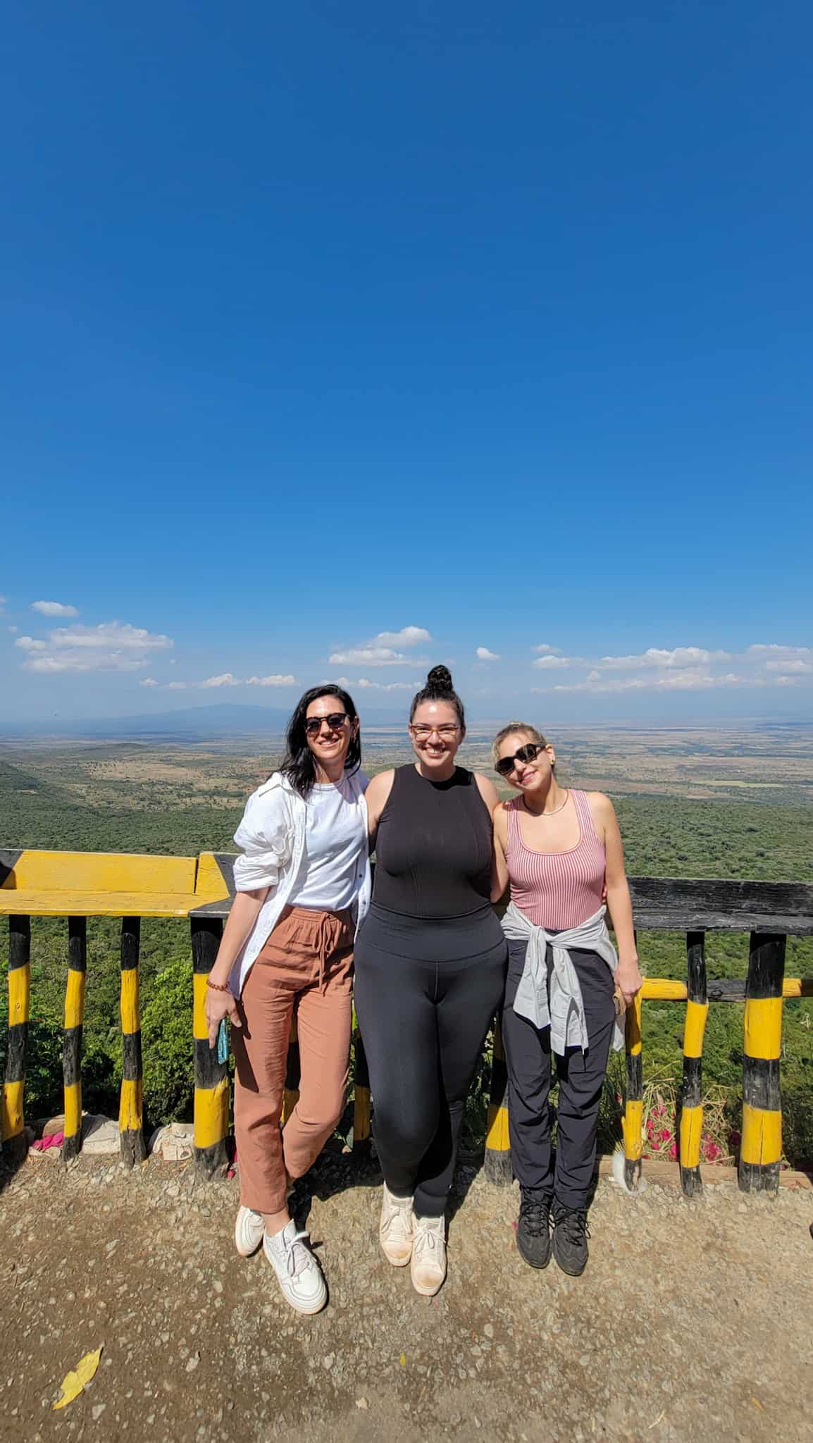 the author and two friends at the great rift valley in kenya