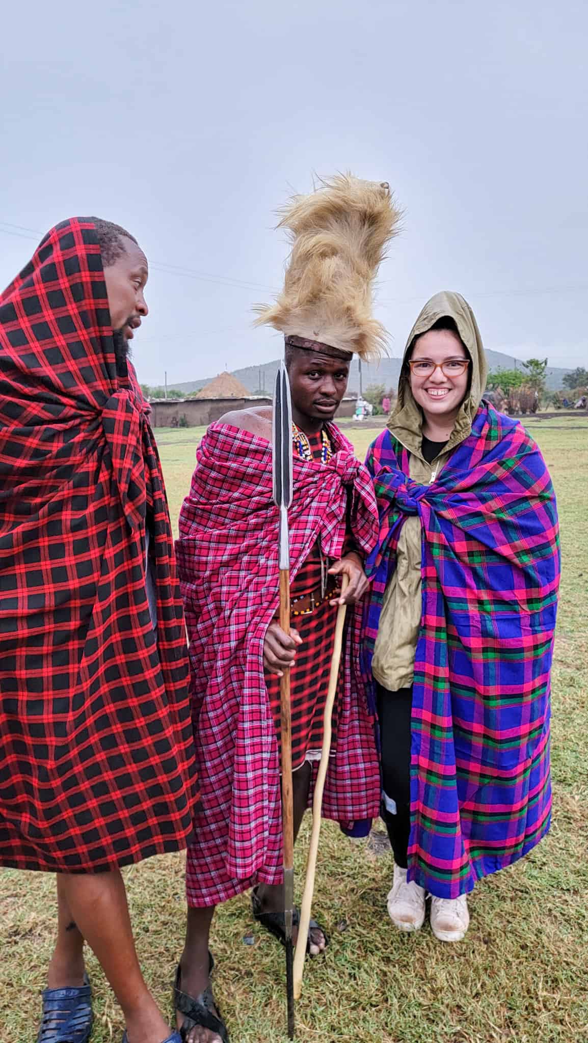 two maasai warriors and the author wearing a waterproof jacket, an item on the packing list for kenya safari trips