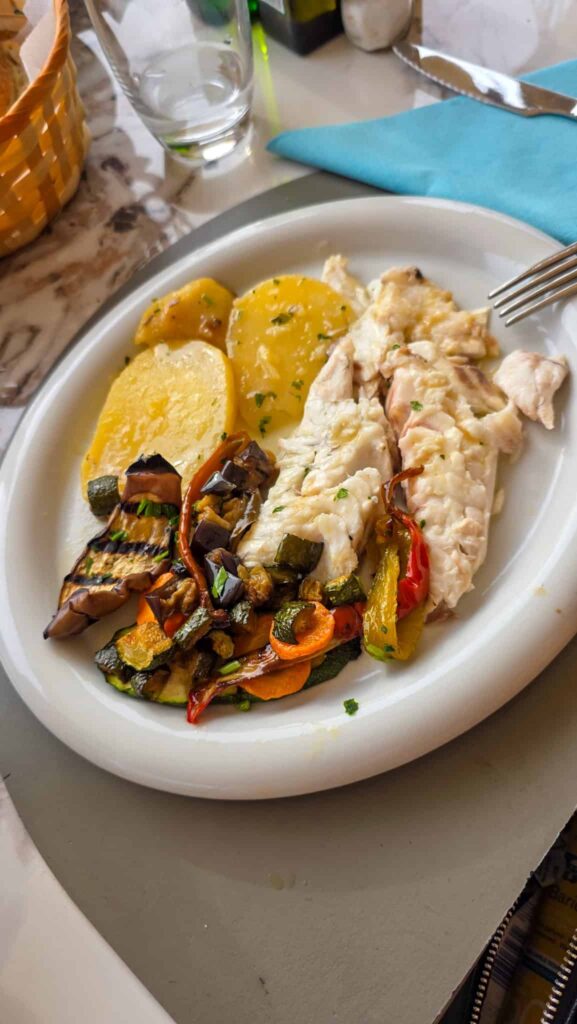 a plate of fish at a restaurant in ischia