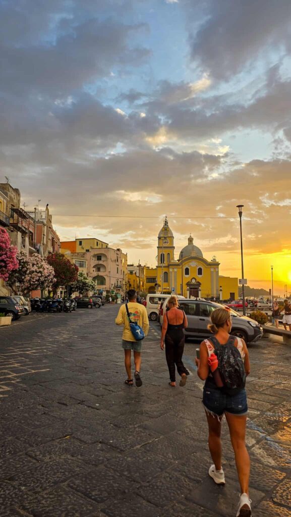 people walking on the street in procida