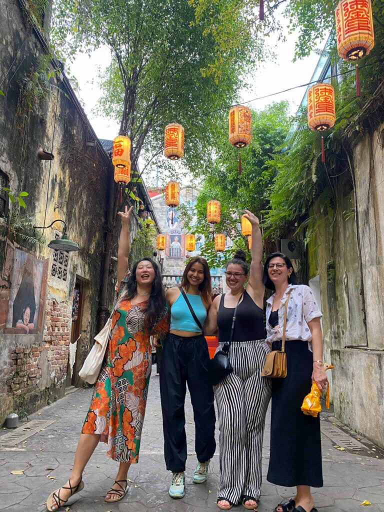 the author and friends she met while on a group trip in kuala lumpur