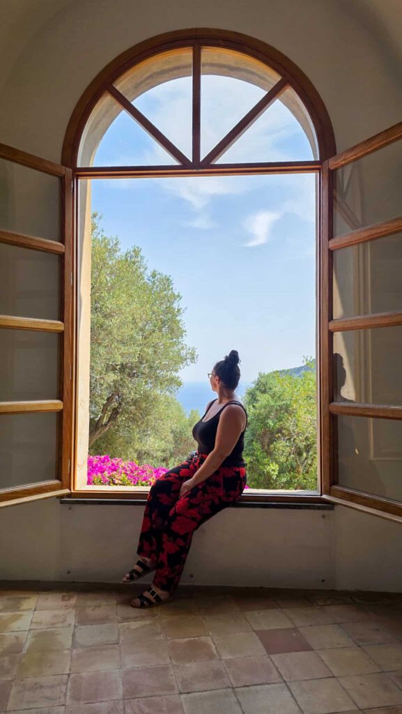the author by a large window at aragonese castle in ischia