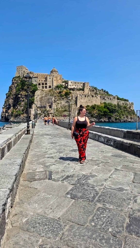 the author in front of the aragonese castle, on the ischia one day itinerary