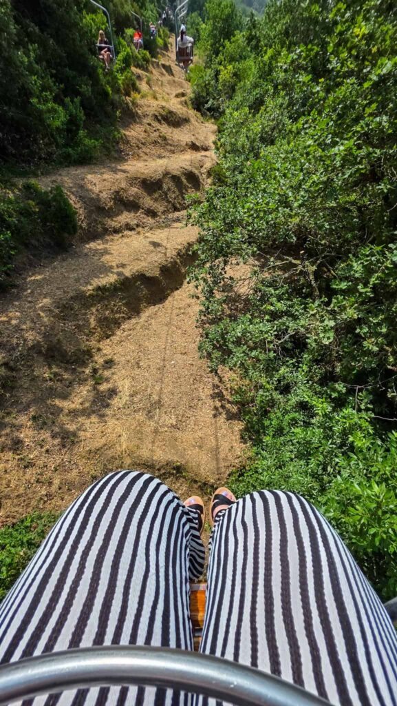 the author's legs on the chair lift in capri