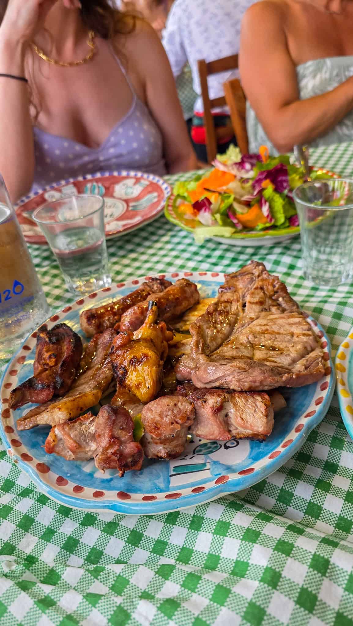 a plate of meat at la tagliata restaurant in positano