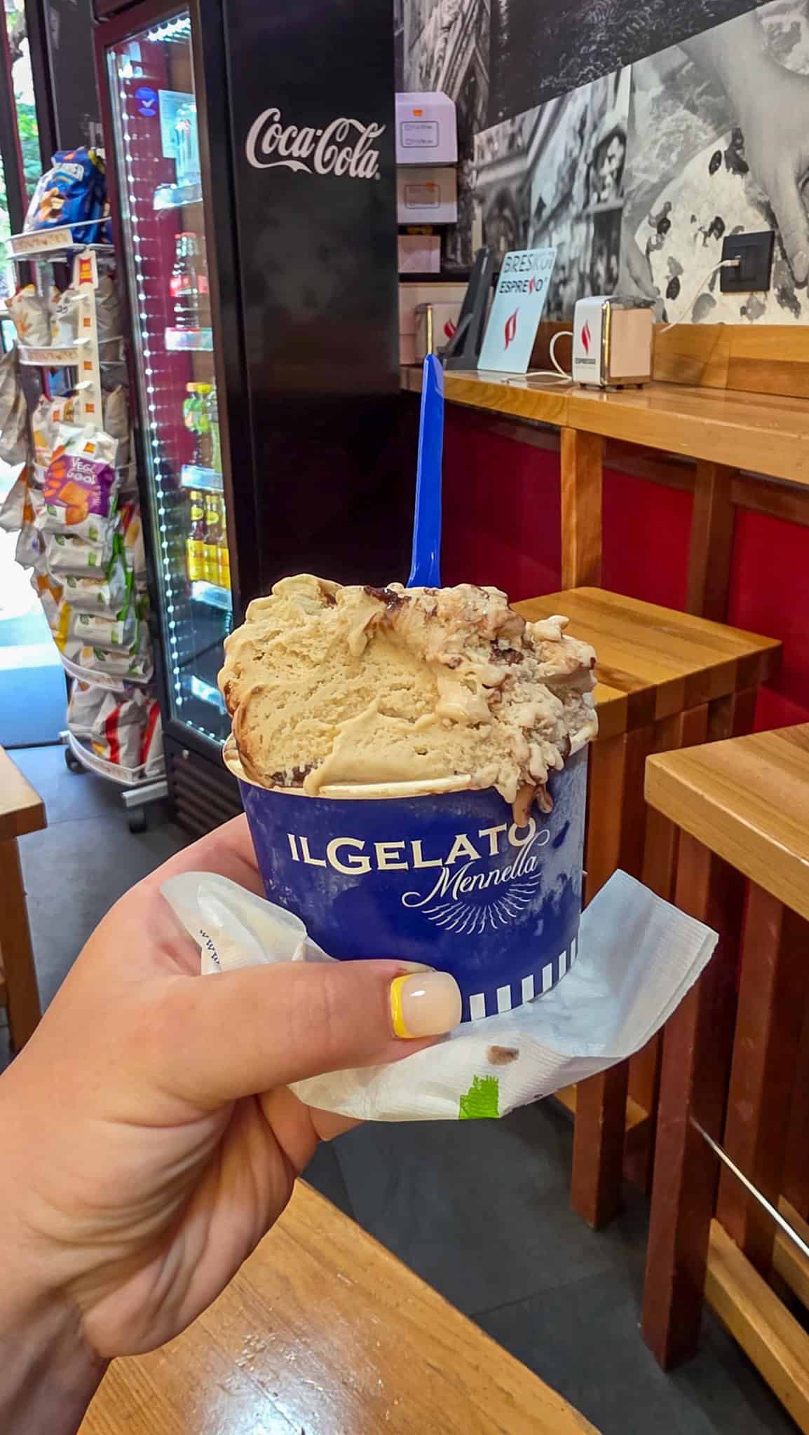 the author holding a cup of gelato