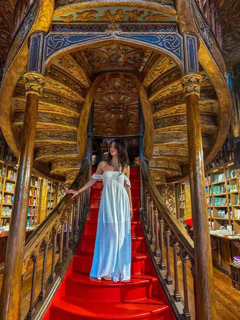 the author in livraria lello in porto