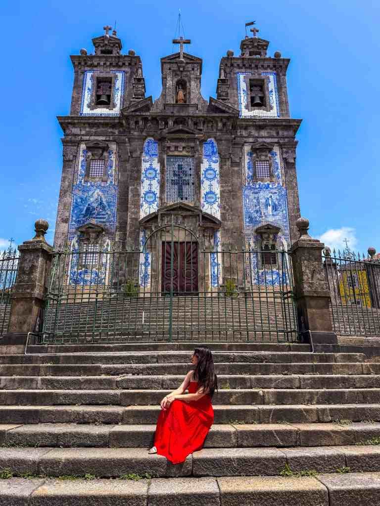 the author on the steps of igreja de santo ildefonso in porto