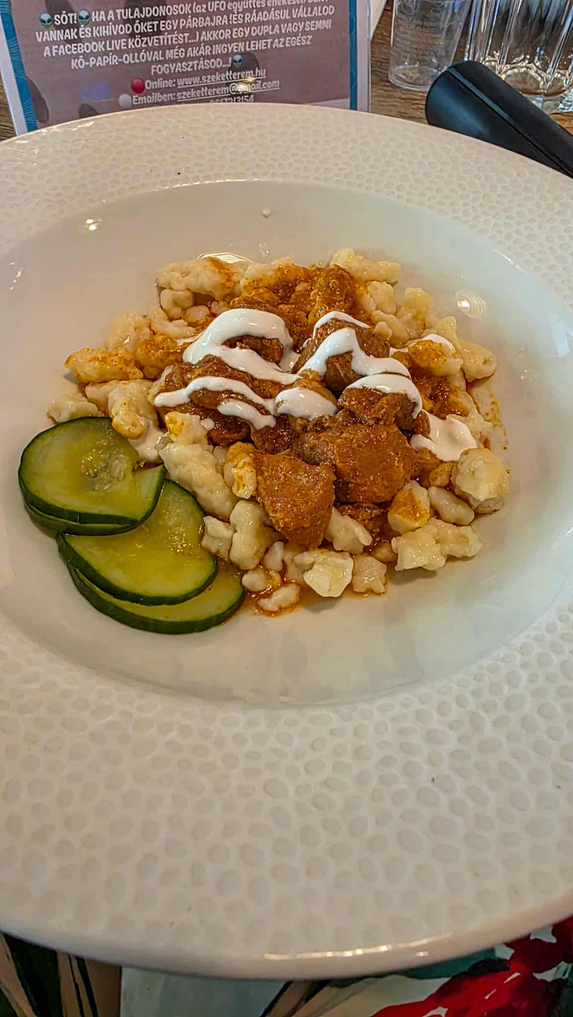 a plate of nokedli dumplings at a restaurant in budapest