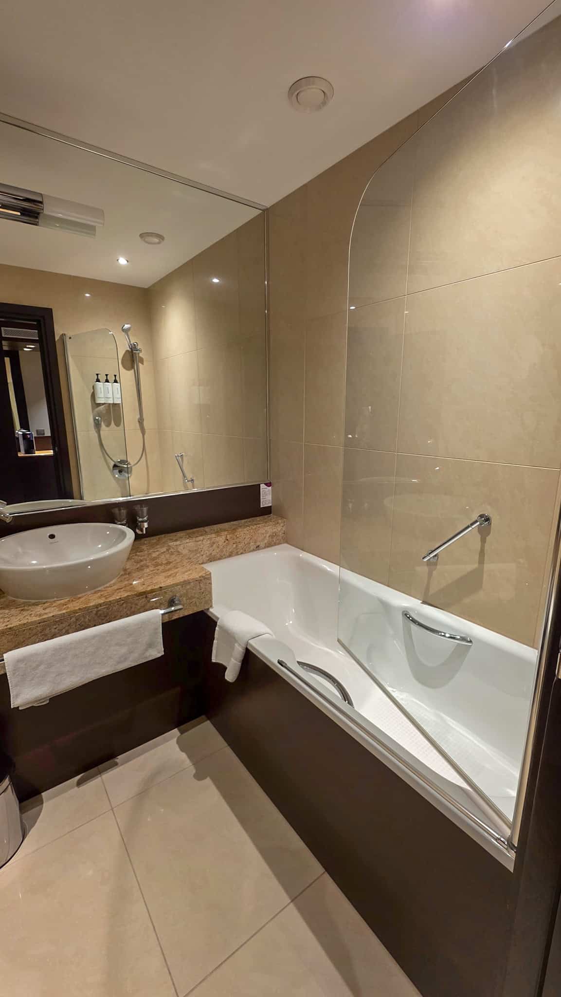 the bathroom at crowne plaza bratislava in old town, one of the best areas to stay in bratislava