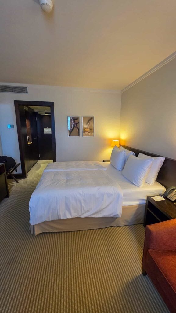 the bed at crowne plaza bratislava in old town, one of the best areas to stay in bratislava