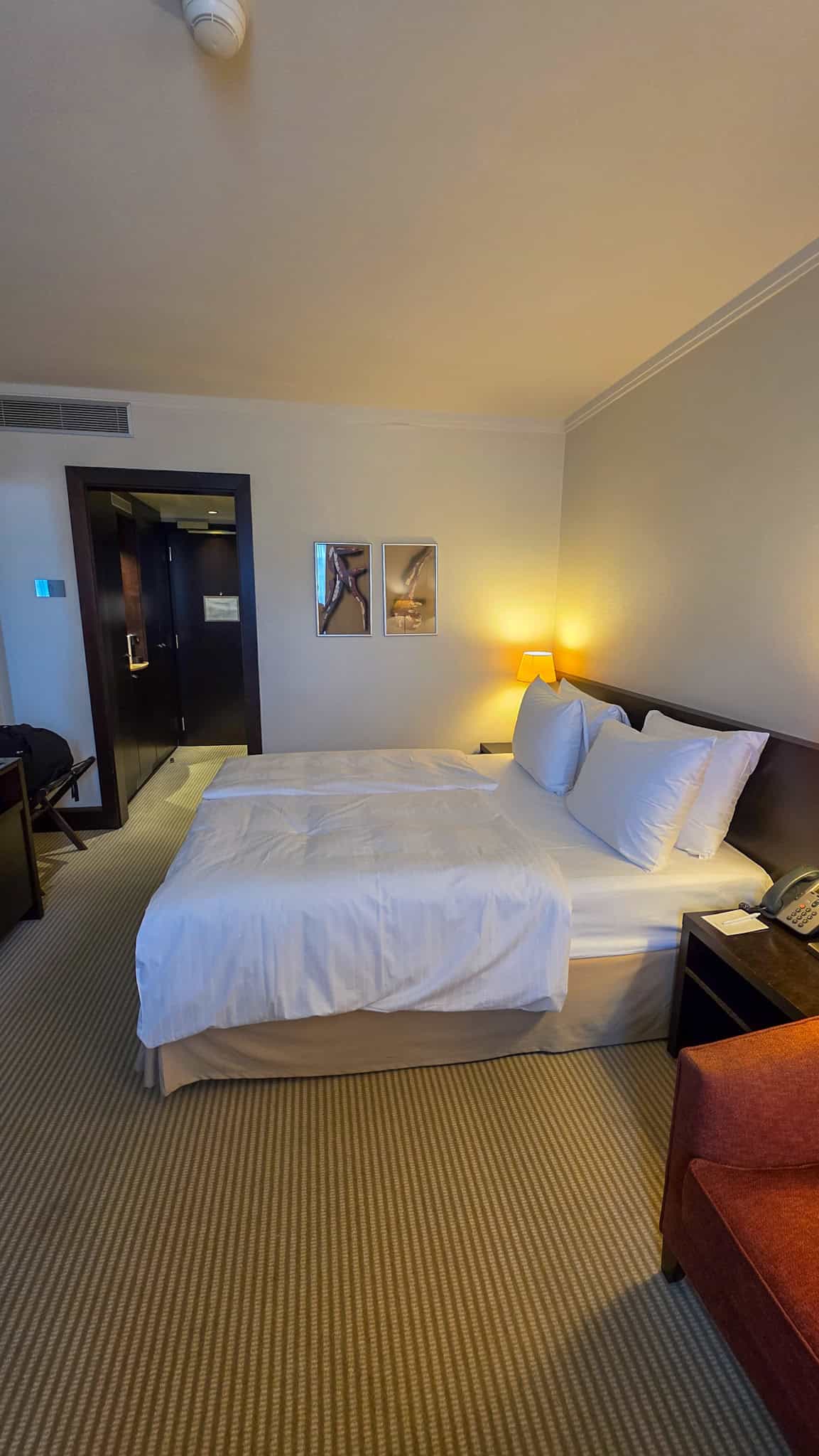 the bed at crowne plaza bratislava in old town, one of the best areas to stay in bratislava