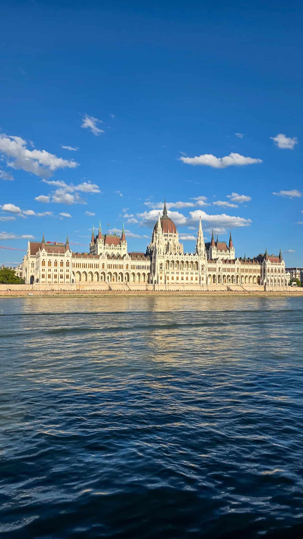 the hungarian parliament building seen from a danube cruise in budapest