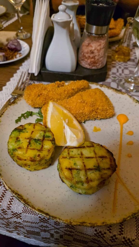 a plate of food at sergiana restaurant in brasov