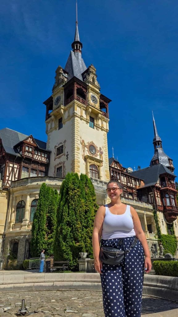 the author in front of peles castle