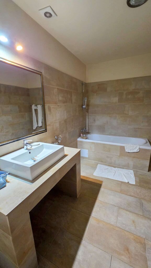 the bathroom at hotel rainer brasov, a hotel on the where to stay in brasov list
