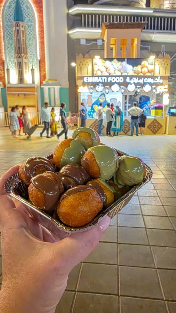 loqaimat with pistachio and nutella sauces at the global village in dubai