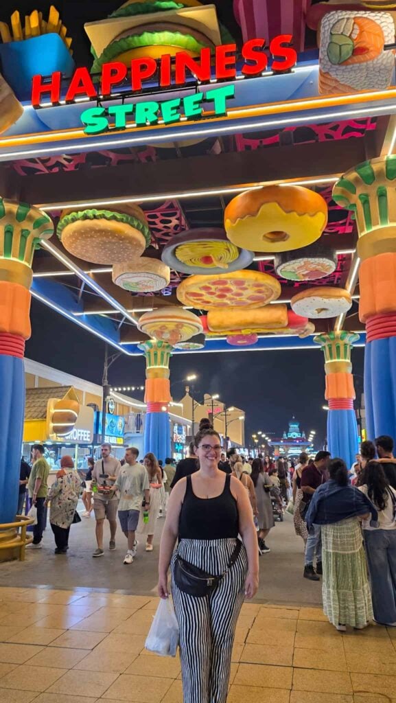 the author on happiness street in global village dubai