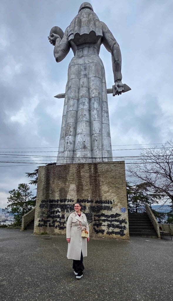 the author with the mother of georgia statue