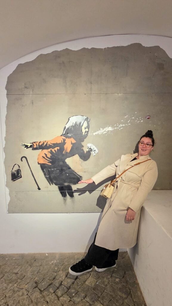 the author at the banksy museum in prague