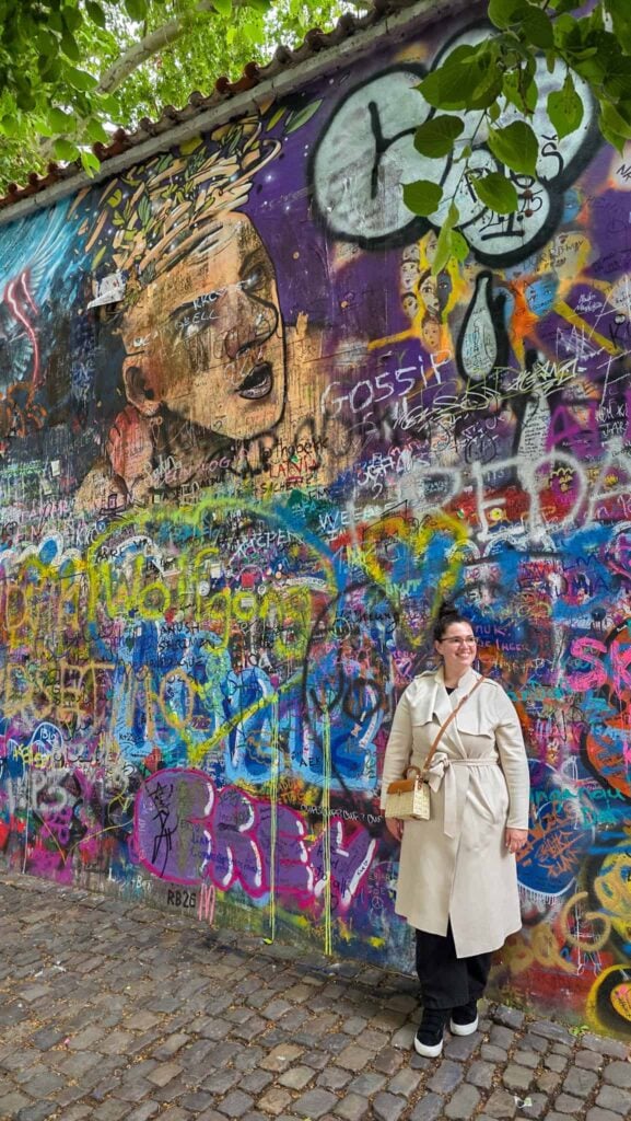the author at the john lennon wall in prague