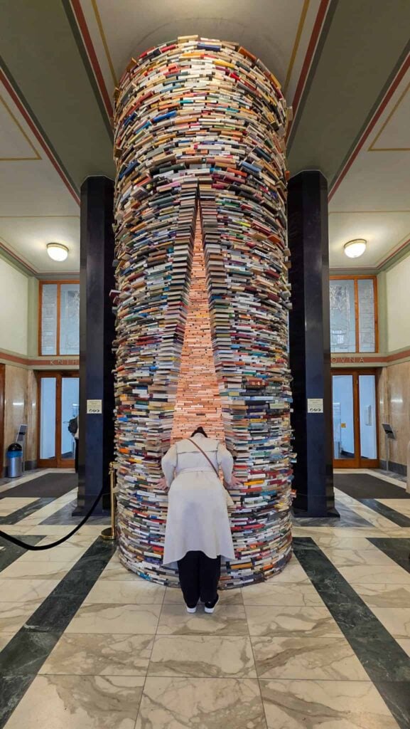 the author looking inside the infinity book tower prague