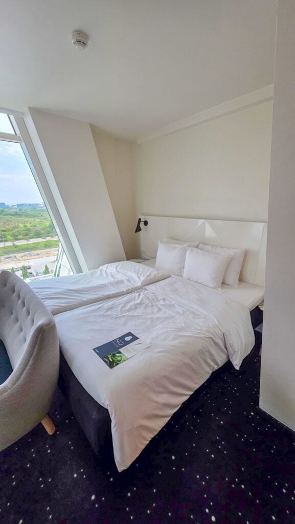 the bed in author's room at AC Hotel Bella Sky Copenhagen