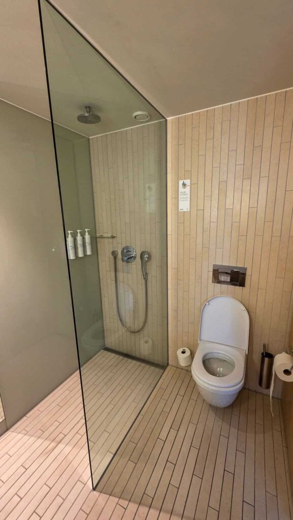 toilet and shower in author's room at AC Hotel Bella Sky Copenhagen