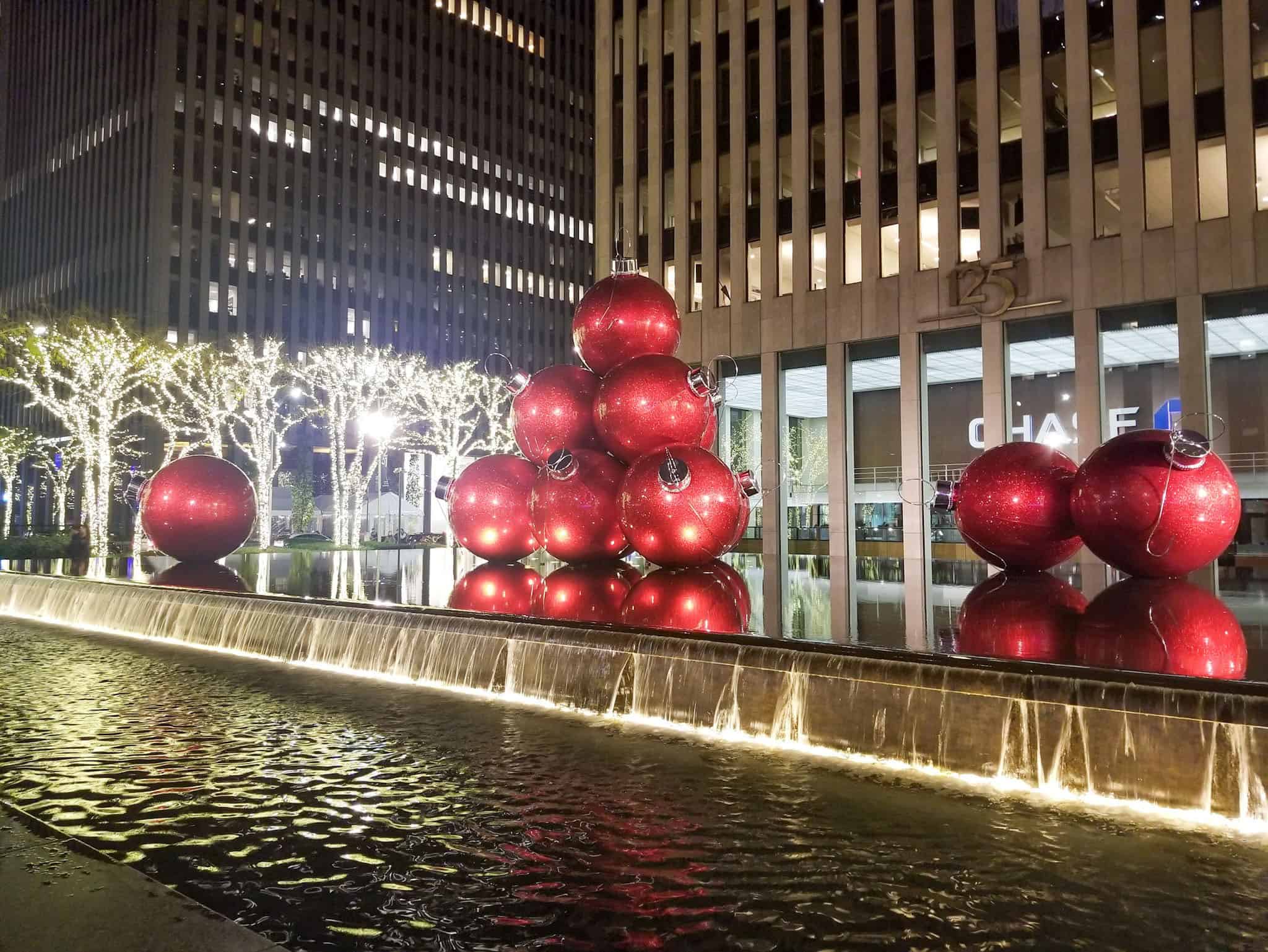 red globe christmas decorations on sixth avenue in nyc